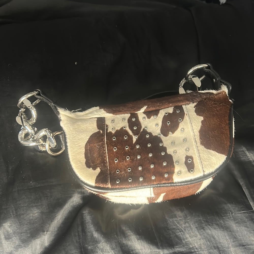 Urban Outfitters faux cowprint mini chain bag